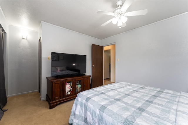 bedroom featuring light colored carpet, baseboards, and ceiling fan