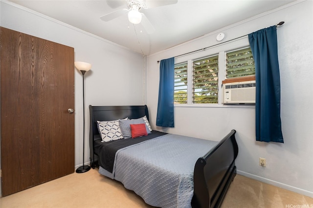 bedroom with cooling unit, baseboards, a ceiling fan, and carpet floors