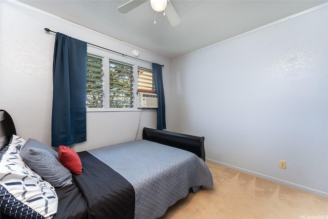 carpeted bedroom featuring ornamental molding, baseboards, cooling unit, and ceiling fan