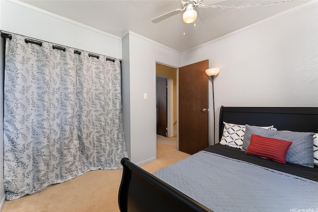 bedroom featuring ornamental molding, ceiling fan, light carpet, and baseboards