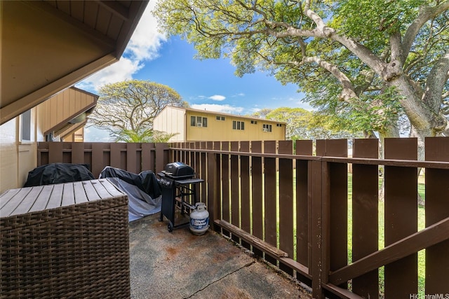 view of patio with fence and area for grilling