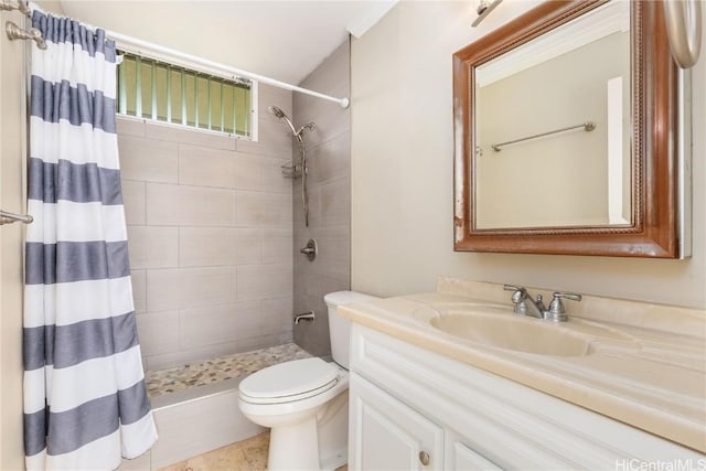 bathroom with vanity, curtained shower, and toilet