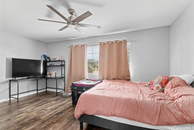 bedroom featuring dark hardwood / wood-style floors and ceiling fan