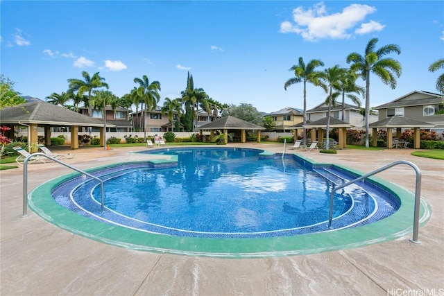 view of swimming pool with a gazebo and a patio