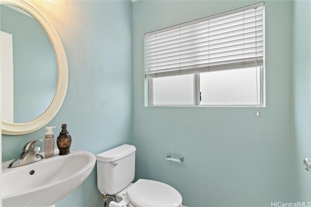 bathroom with sink and toilet