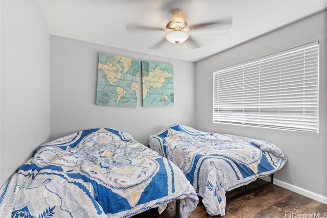 bedroom featuring ceiling fan and dark hardwood / wood-style flooring