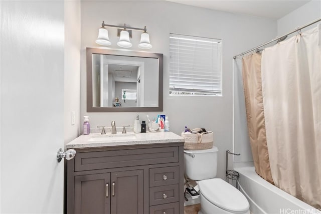 full bathroom featuring vanity, shower / tub combo, and toilet