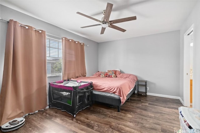 bedroom featuring dark hardwood / wood-style flooring and ceiling fan