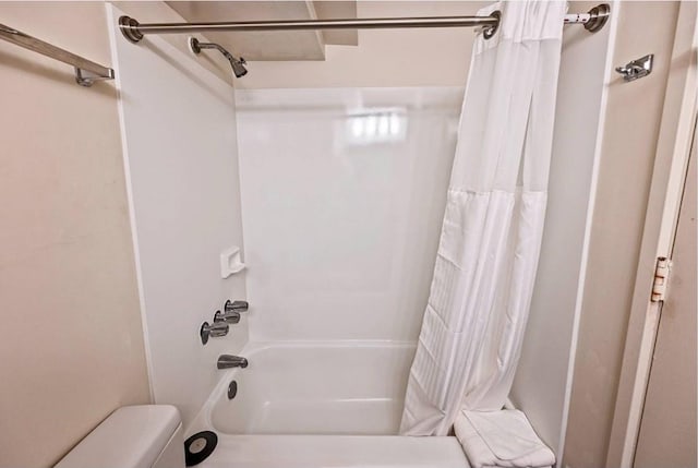 bathroom with shower / bathtub combination with curtain and toilet