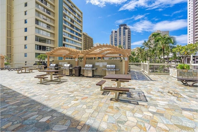 view of patio featuring a grill and a pergola