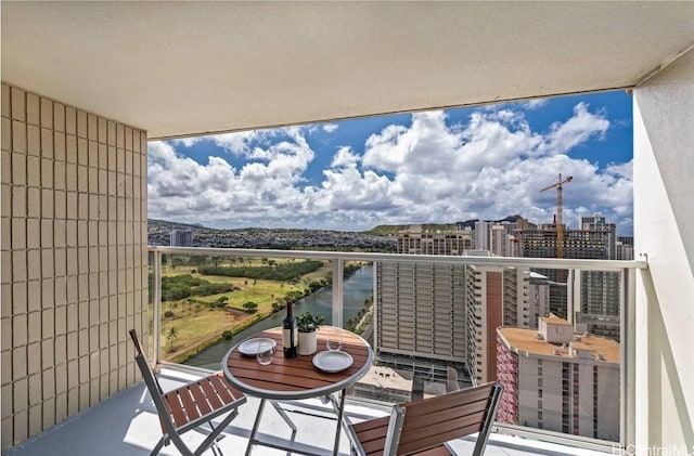 balcony featuring a water view