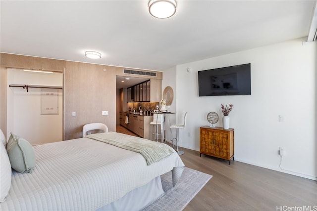 1000 Auahi St Unit 2505, Honolulu, HI 96814 - bedroom featuring visible vents and light wood-style flooring