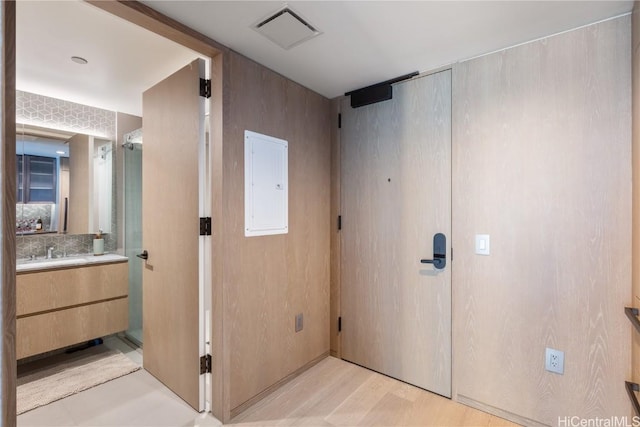 1000 Auahi St Unit 2505, Honolulu, HI 96814 - interior space with wood finished floors, vanity, visible vents, and electric panel