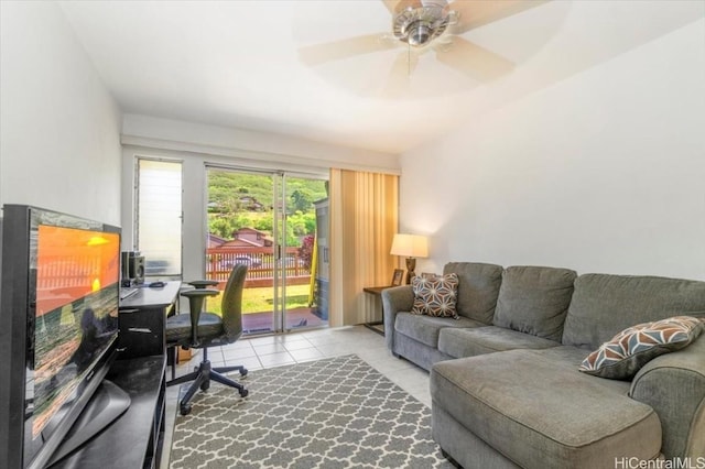 office area with light tile patterned floors and ceiling fan