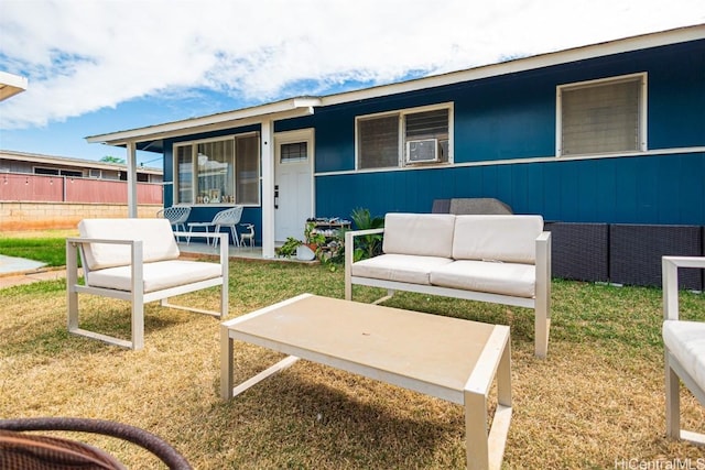 view of front of property featuring a front yard and outdoor lounge area