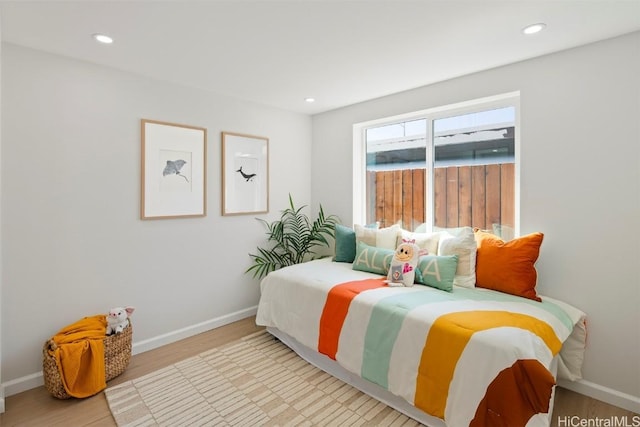 bedroom with light wood-type flooring