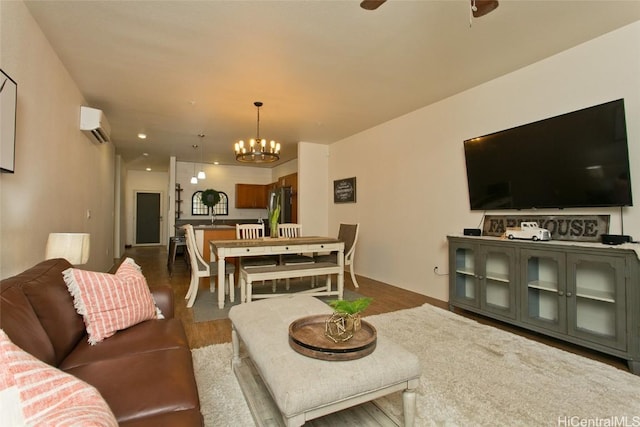 living room with ceiling fan with notable chandelier, dark wood-type flooring, an AC wall unit, and vaulted ceiling