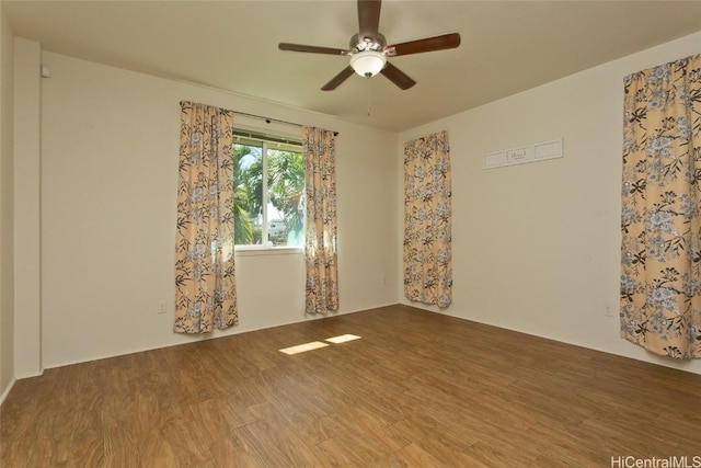 spare room featuring ceiling fan and wood-type flooring