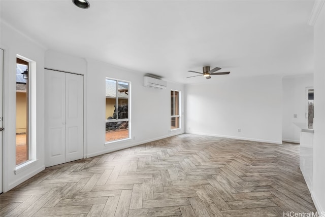 unfurnished living room with ceiling fan, light parquet flooring, and a wall mounted AC