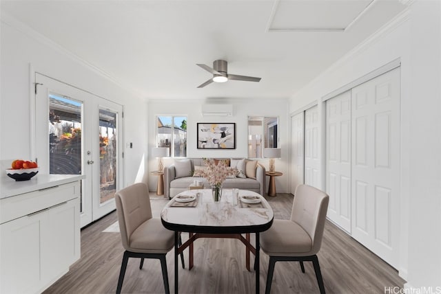 dining room with ornamental molding, an AC wall unit, and dark hardwood / wood-style flooring