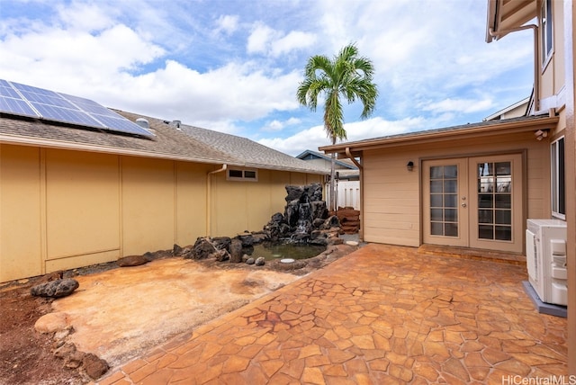 view of patio with ac unit and french doors