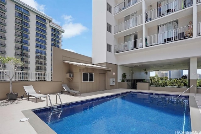 view of swimming pool featuring a patio