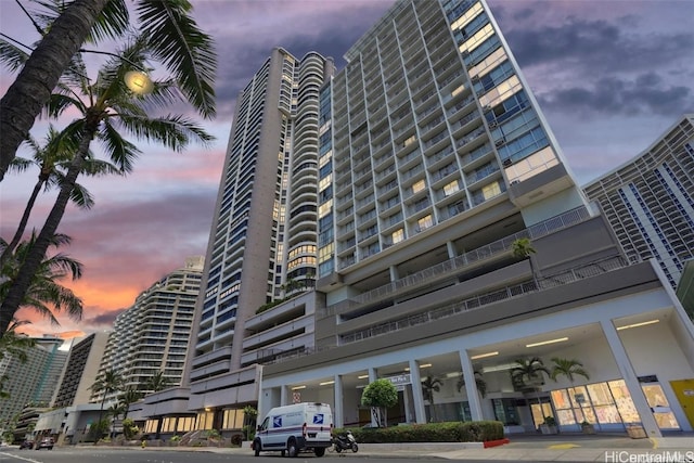 view of outdoor building at dusk