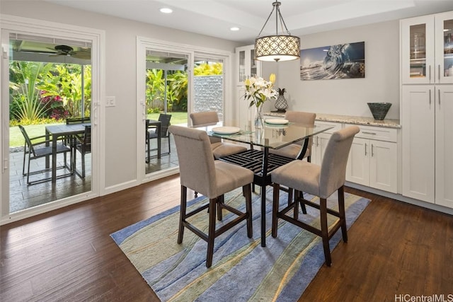 dining area with dark hardwood / wood-style floors