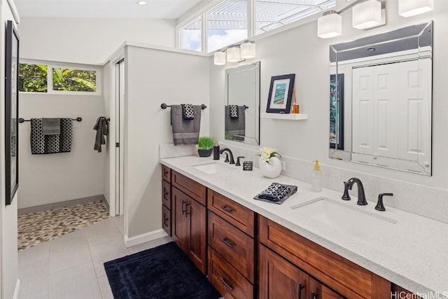 bathroom with tile patterned floors and vanity