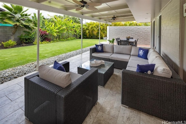 view of patio with an outdoor living space and ceiling fan