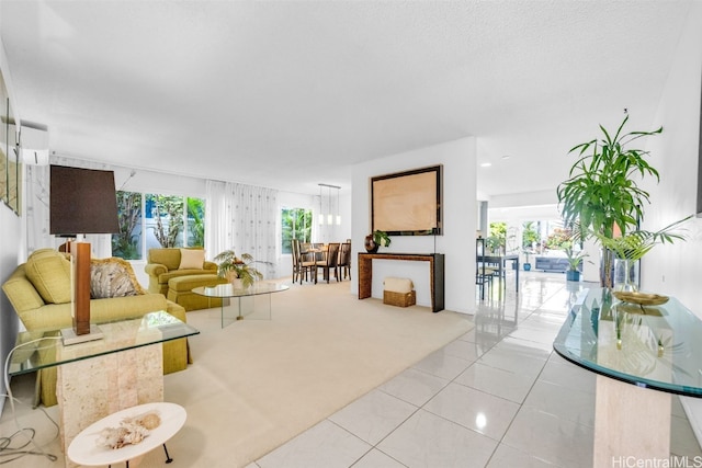 living room featuring light tile patterned floors and a wall mounted AC