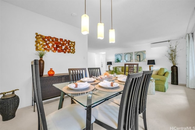 dining room featuring light carpet