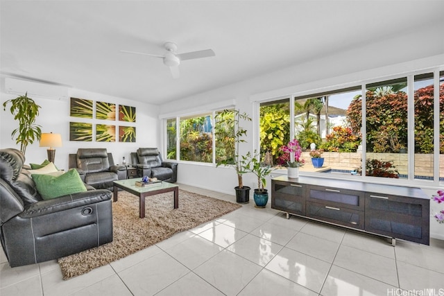 sunroom / solarium featuring ceiling fan and a wall unit AC