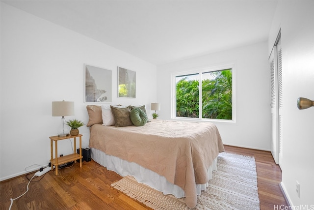 bedroom with wood-type flooring