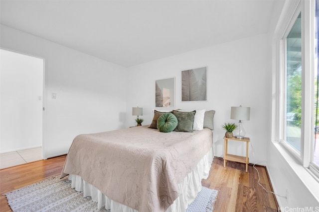 bedroom with light hardwood / wood-style flooring