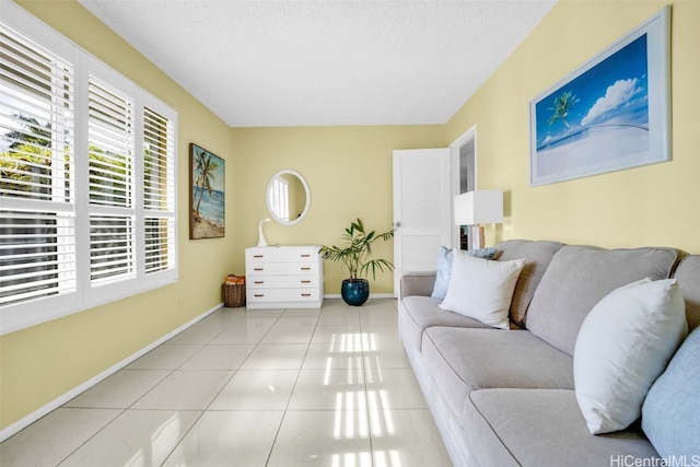 tiled living room with a textured ceiling