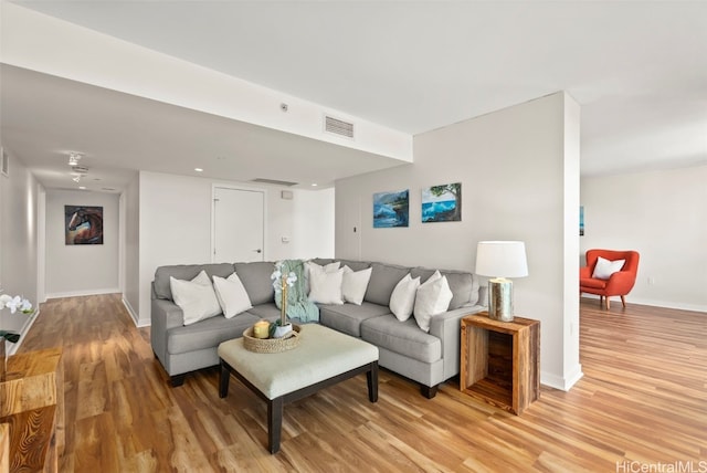 living room with light hardwood / wood-style floors