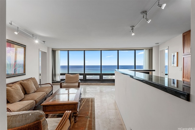 1330 Ala Moana Blvd Unit 3204, Honolulu, HI 96814 - living area featuring rail lighting, a water view, expansive windows, and healthy amount of natural light