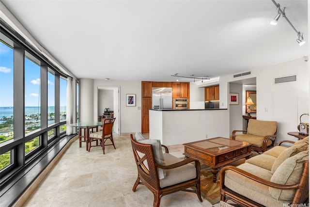1330 Ala Moana Blvd Unit 3204, Honolulu, HI 96814 - living area featuring rail lighting and a water view