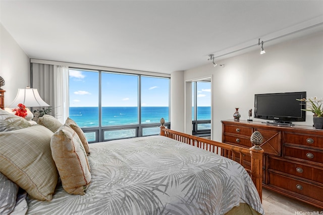 1330 Ala Moana Blvd Unit 3204, Honolulu, HI 96814 - bedroom with track lighting, a wall of windows, and access to exterior