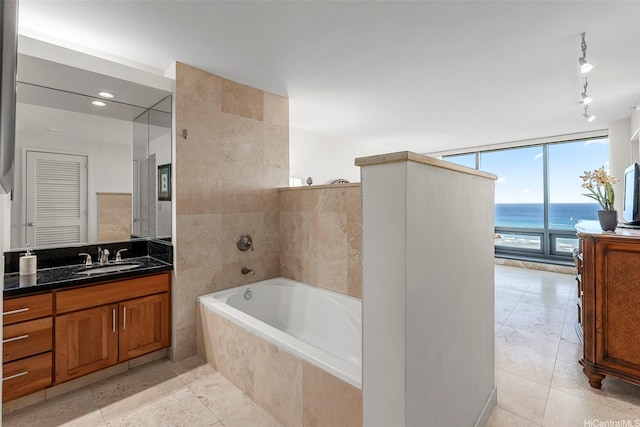 1330 Ala Moana Blvd Unit 3204, Honolulu, HI 96814 - full bathroom featuring a bath, vanity, track lighting, and tile patterned flooring
