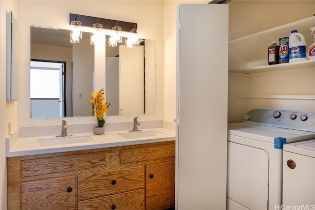 bathroom with independent washer and dryer and vanity