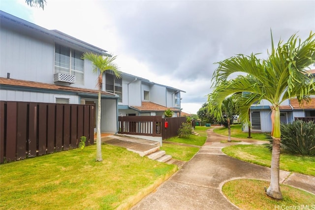 surrounding community featuring a yard