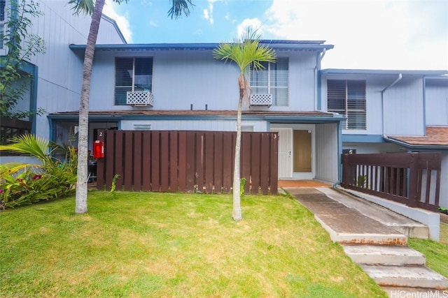 view of front of home with a front lawn