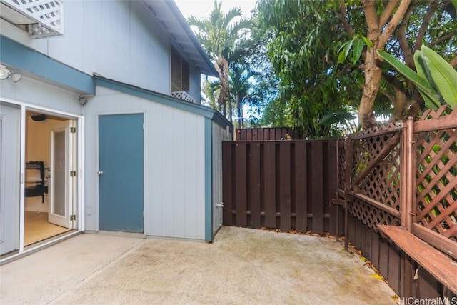 view of side of property with a patio