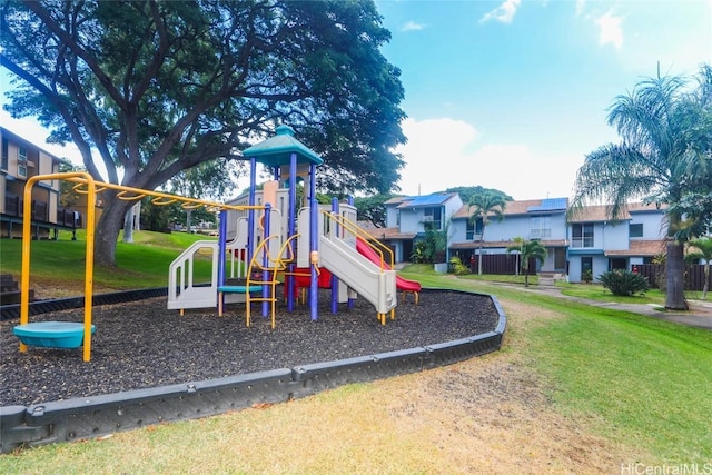 view of jungle gym with a lawn