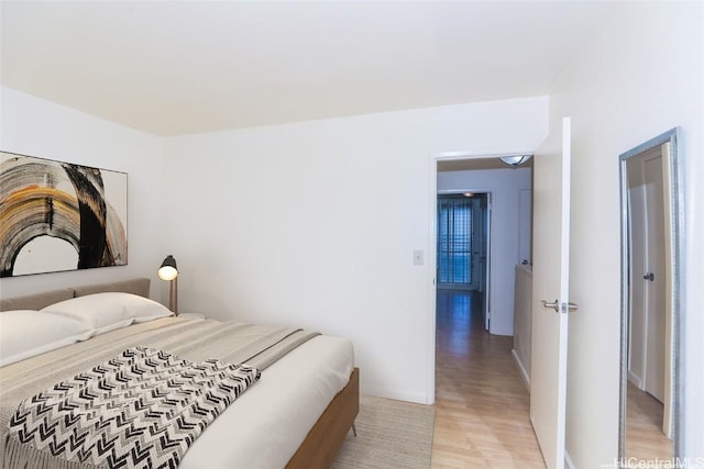 bedroom with light hardwood / wood-style flooring