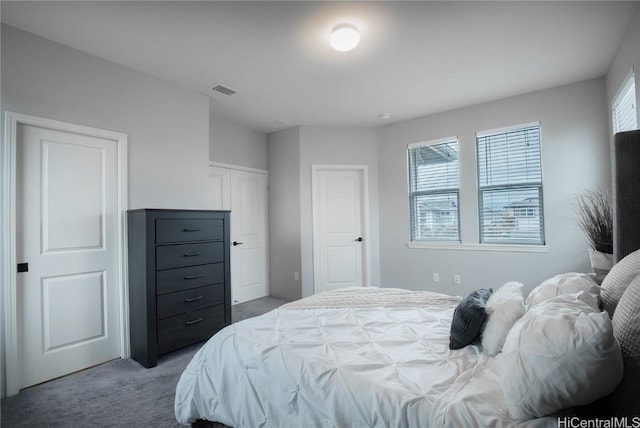 bedroom with multiple windows and carpet flooring