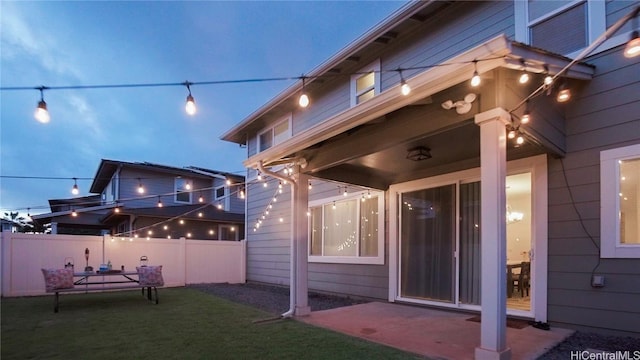 exterior space featuring a patio area and a lawn