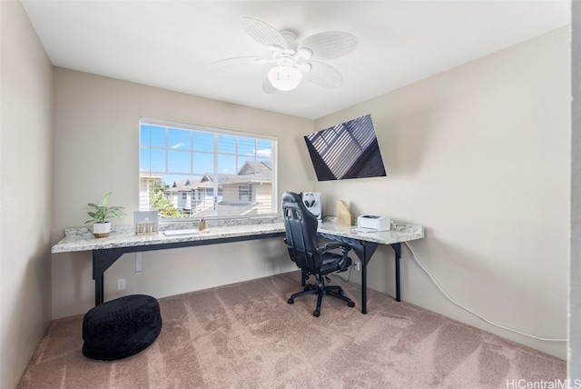 carpeted home office with ceiling fan